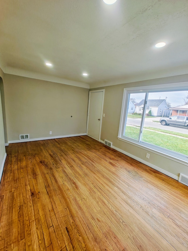 unfurnished room featuring light wood-type flooring