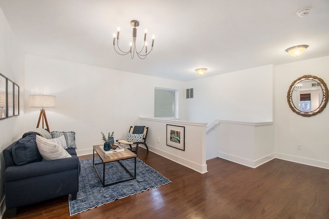 interior space featuring dark hardwood / wood-style floors and a notable chandelier