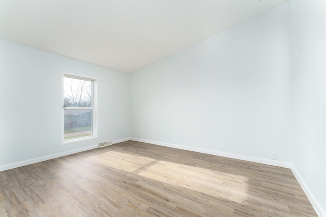 unfurnished room featuring light wood-type flooring