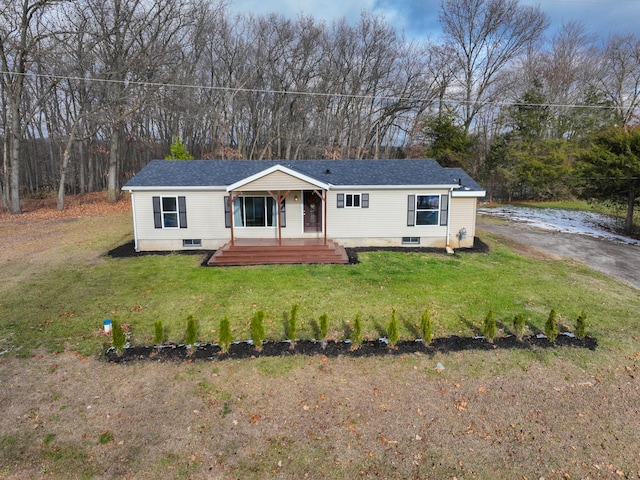 view of front of house featuring covered porch and a front lawn