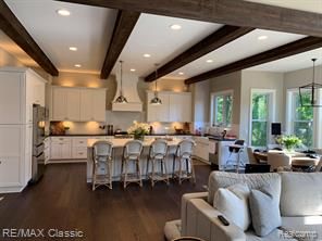 kitchen with white cabinetry and hanging light fixtures