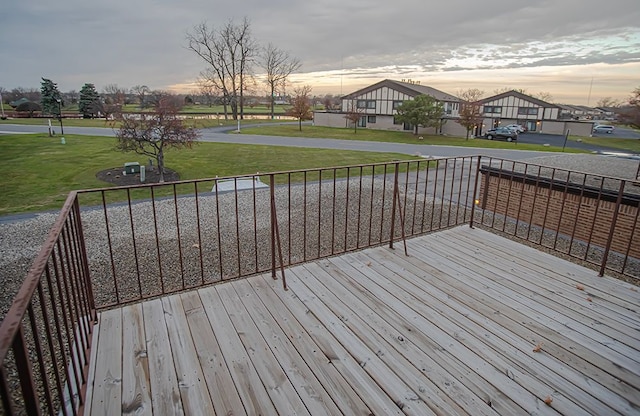 deck at dusk with a lawn