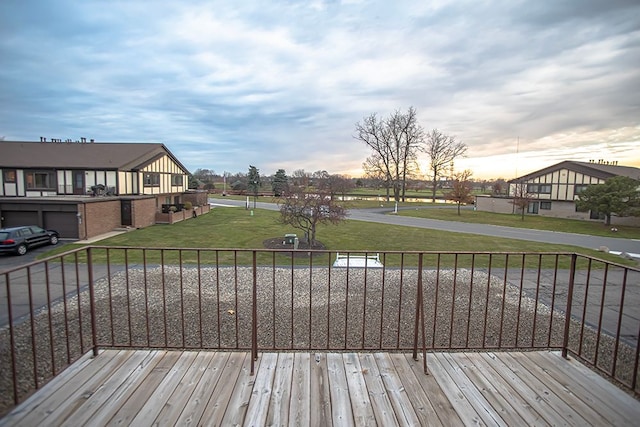 deck at dusk with a lawn