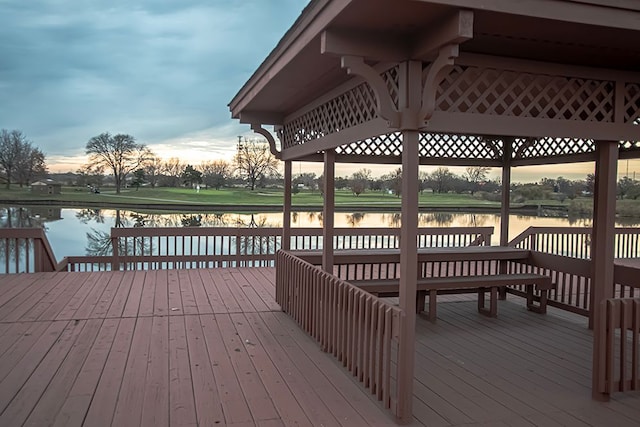 dock area featuring a deck with water view