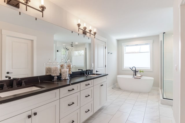 bathroom featuring vanity and independent shower and bath