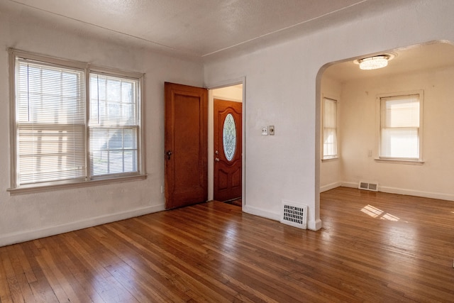 entrance foyer featuring dark hardwood / wood-style flooring