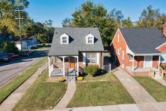 view of front of home featuring a front yard and a porch