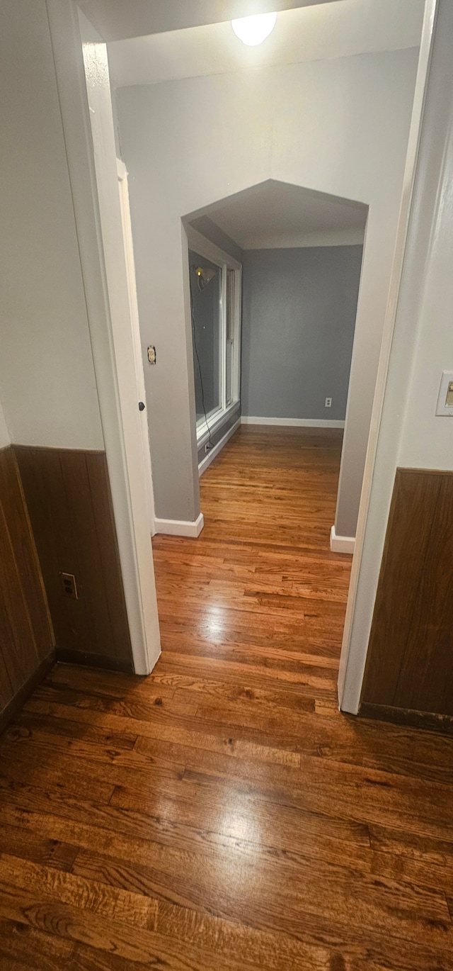 hallway with dark hardwood / wood-style floors