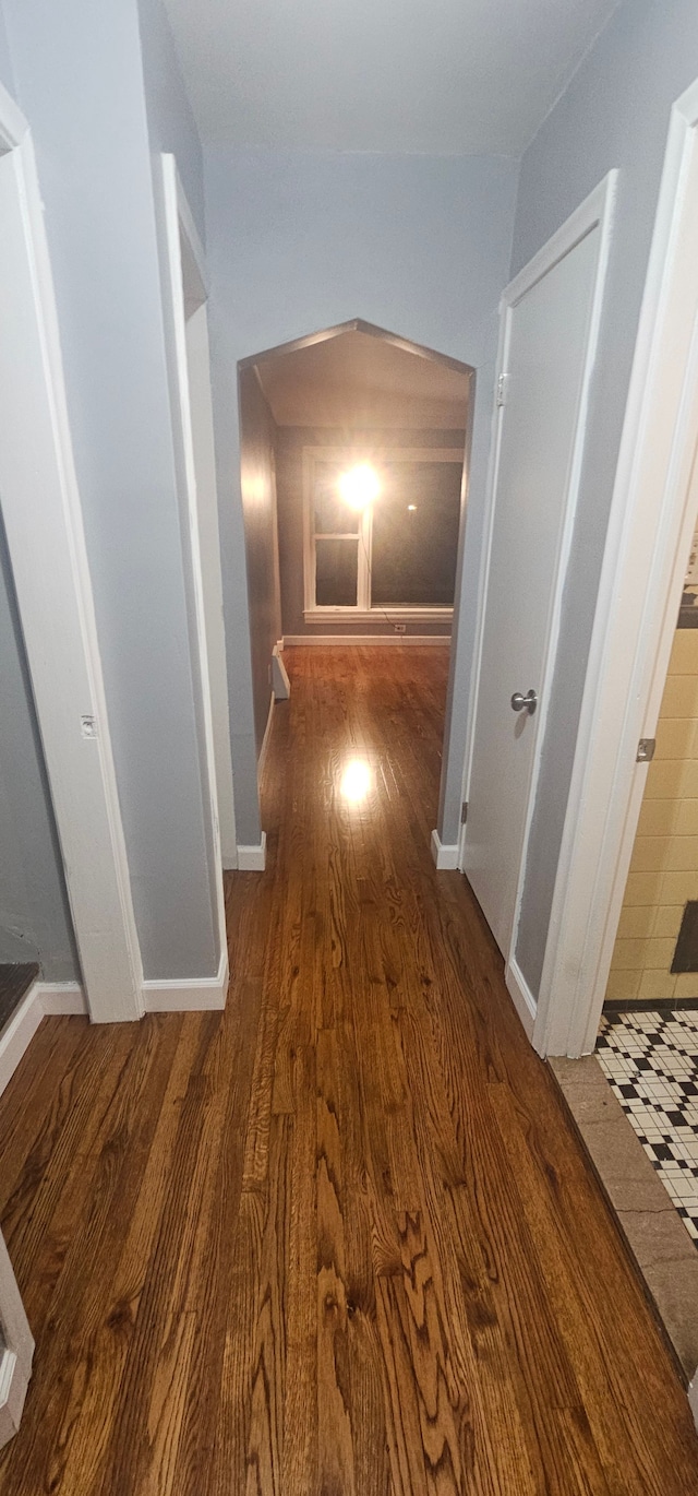 hallway featuring dark hardwood / wood-style floors