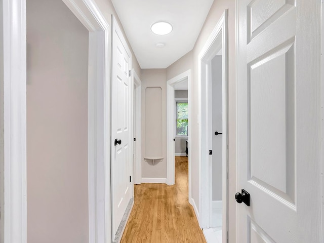 hall with light hardwood / wood-style floors