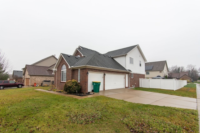 view of side of property featuring a garage and a lawn