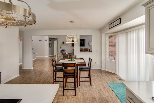 dining room with light hardwood / wood-style flooring