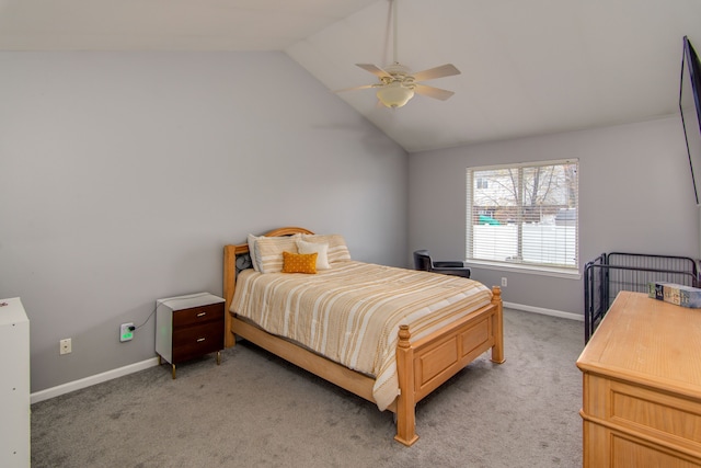 carpeted bedroom with ceiling fan and lofted ceiling