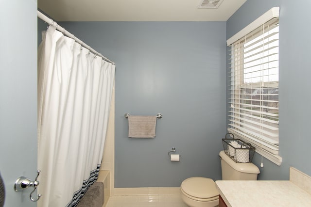 full bathroom with toilet, shower / bath combination with curtain, vanity, and tile patterned floors