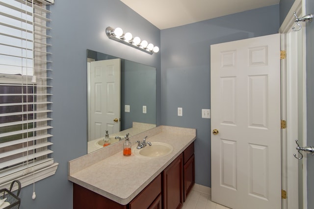 bathroom with tile patterned floors and vanity