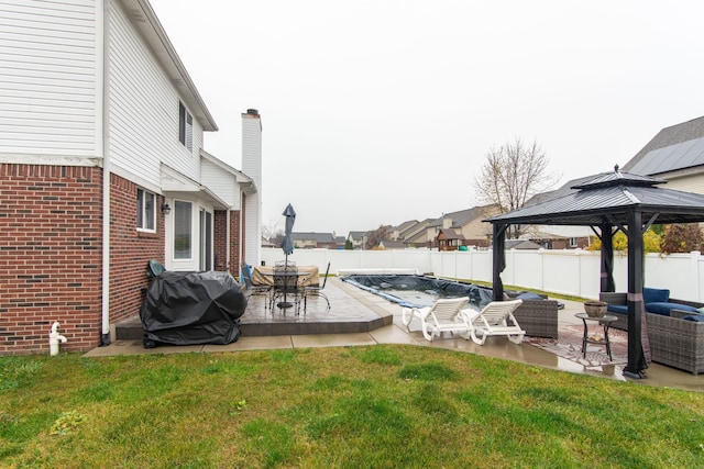 view of yard featuring a gazebo, a patio, and an outdoor living space