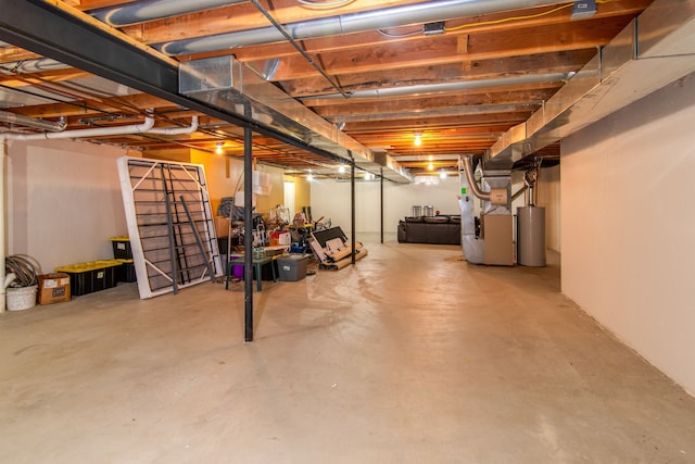 basement with heating unit and water heater