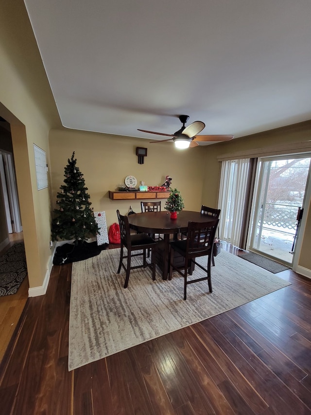 dining area featuring hardwood / wood-style floors and ceiling fan