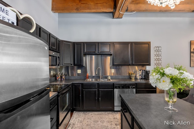 kitchen with sink, light hardwood / wood-style flooring, beam ceiling, dark brown cabinetry, and stainless steel appliances