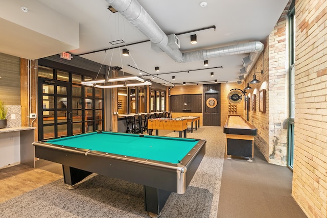 playroom featuring billiards and brick wall