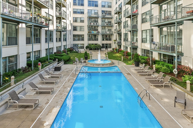 view of swimming pool featuring pool water feature