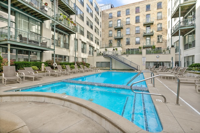 view of swimming pool featuring a patio area