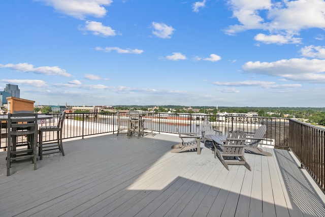 wooden deck featuring a water view