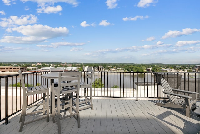 wooden deck featuring a water view