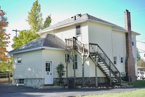 rear view of house with central air condition unit