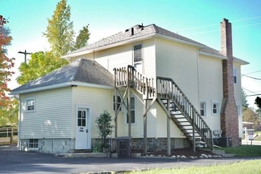 rear view of house with central air condition unit