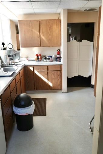 kitchen with a drop ceiling and sink