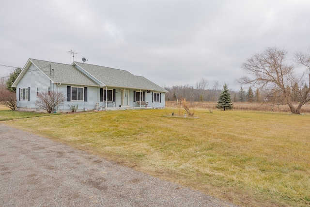 view of front of property featuring a porch and a front lawn