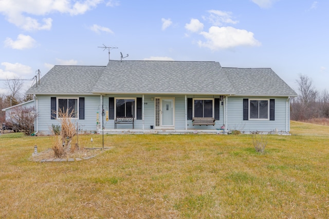 ranch-style home featuring a porch and a front lawn