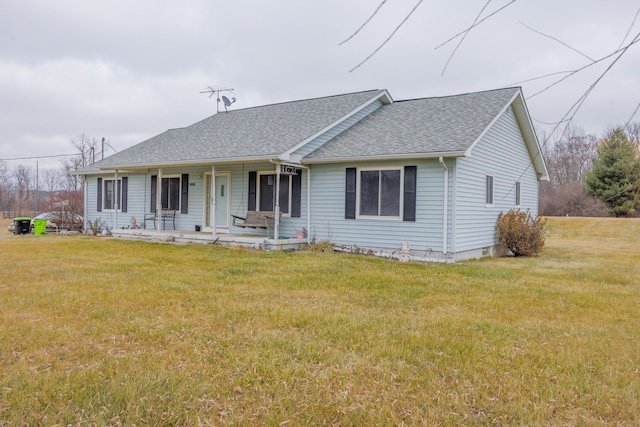 ranch-style house with covered porch and a front yard