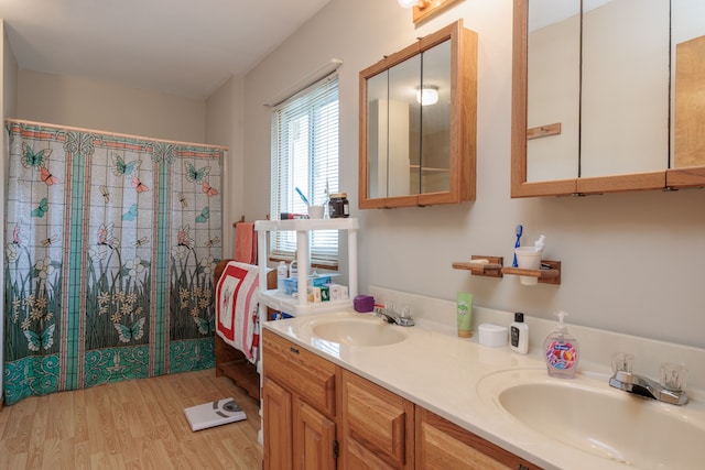 bathroom featuring hardwood / wood-style flooring and vanity