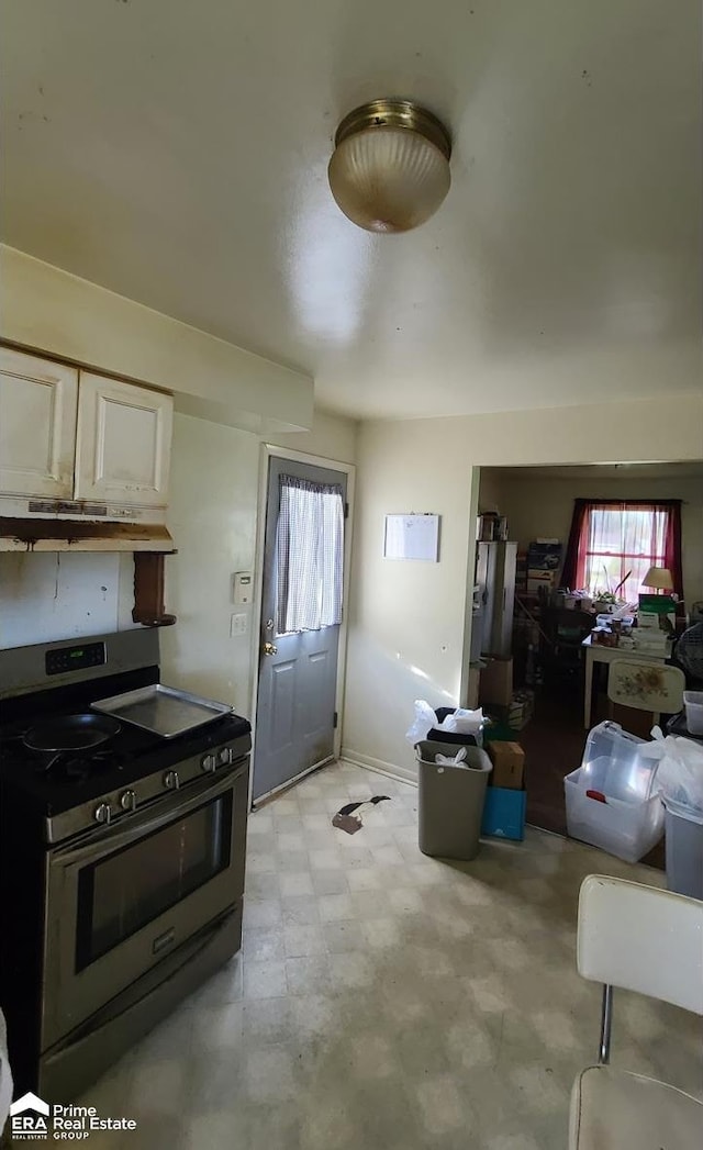 kitchen featuring white cabinetry and stainless steel gas range