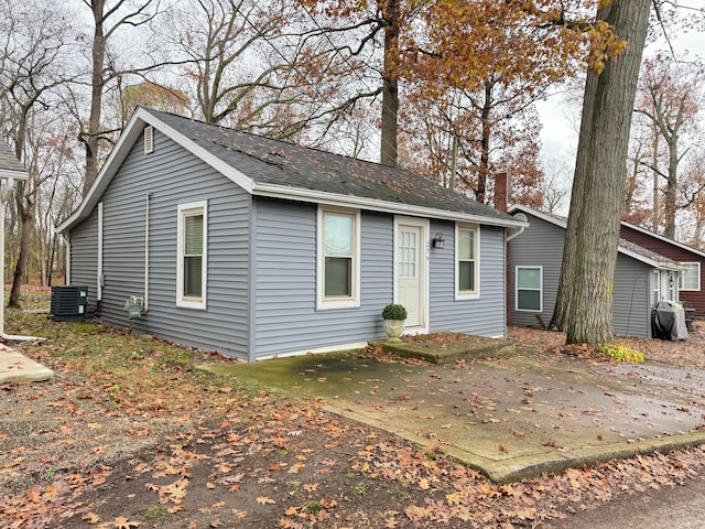 ranch-style house with central AC unit