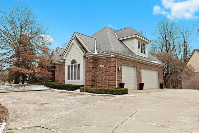 view of side of home featuring a garage