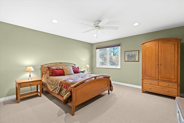 bedroom featuring ceiling fan and light carpet