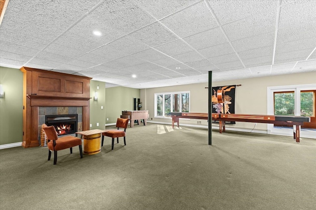 playroom featuring a fireplace, plenty of natural light, and carpet