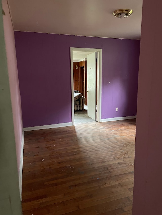 spare room featuring dark wood-type flooring