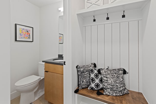 bathroom with toilet and vanity