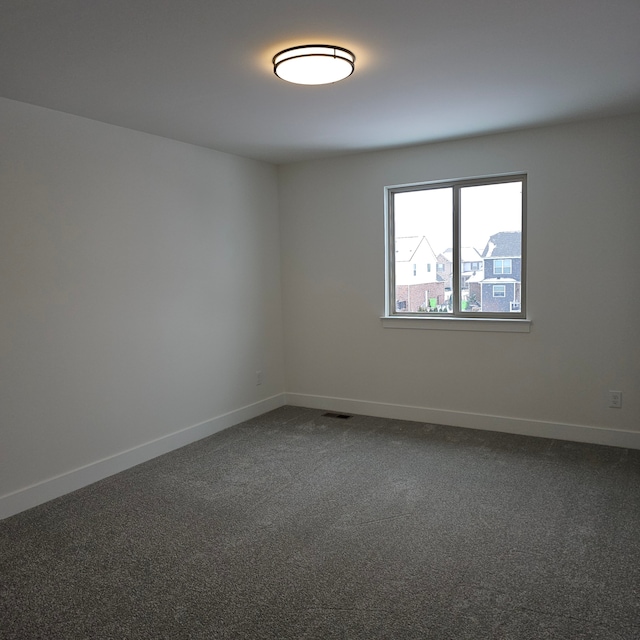 unfurnished room with carpet flooring