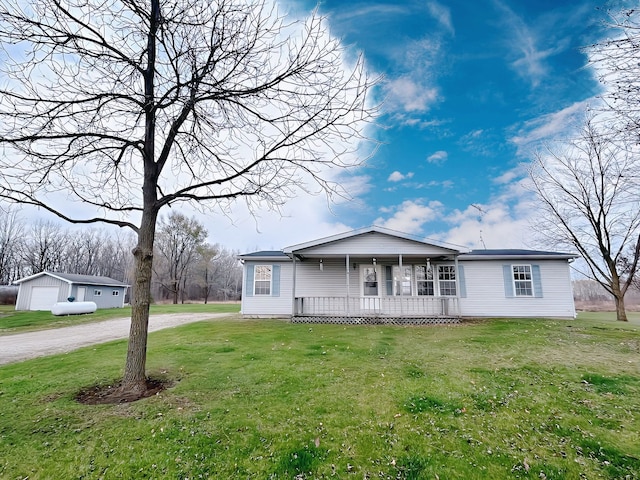 ranch-style home with a porch and a front yard