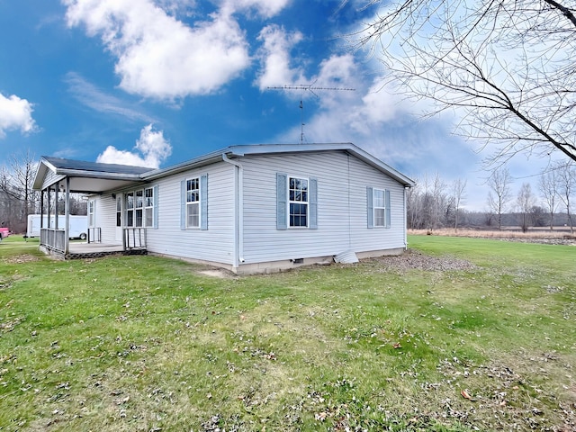 view of home's exterior with a yard