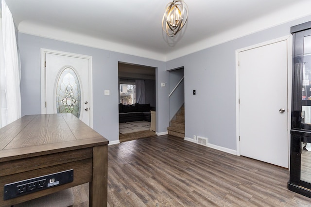 entryway with a notable chandelier and hardwood / wood-style flooring