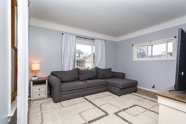 carpeted living room featuring a healthy amount of sunlight