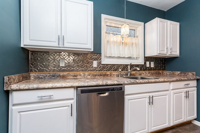 kitchen featuring white cabinetry, sink, tasteful backsplash, stainless steel dishwasher, and pendant lighting