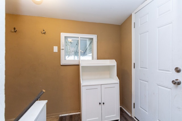 washroom with dark hardwood / wood-style flooring