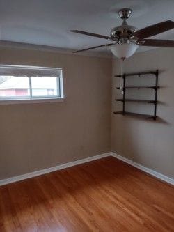 unfurnished room featuring ceiling fan and wood-type flooring